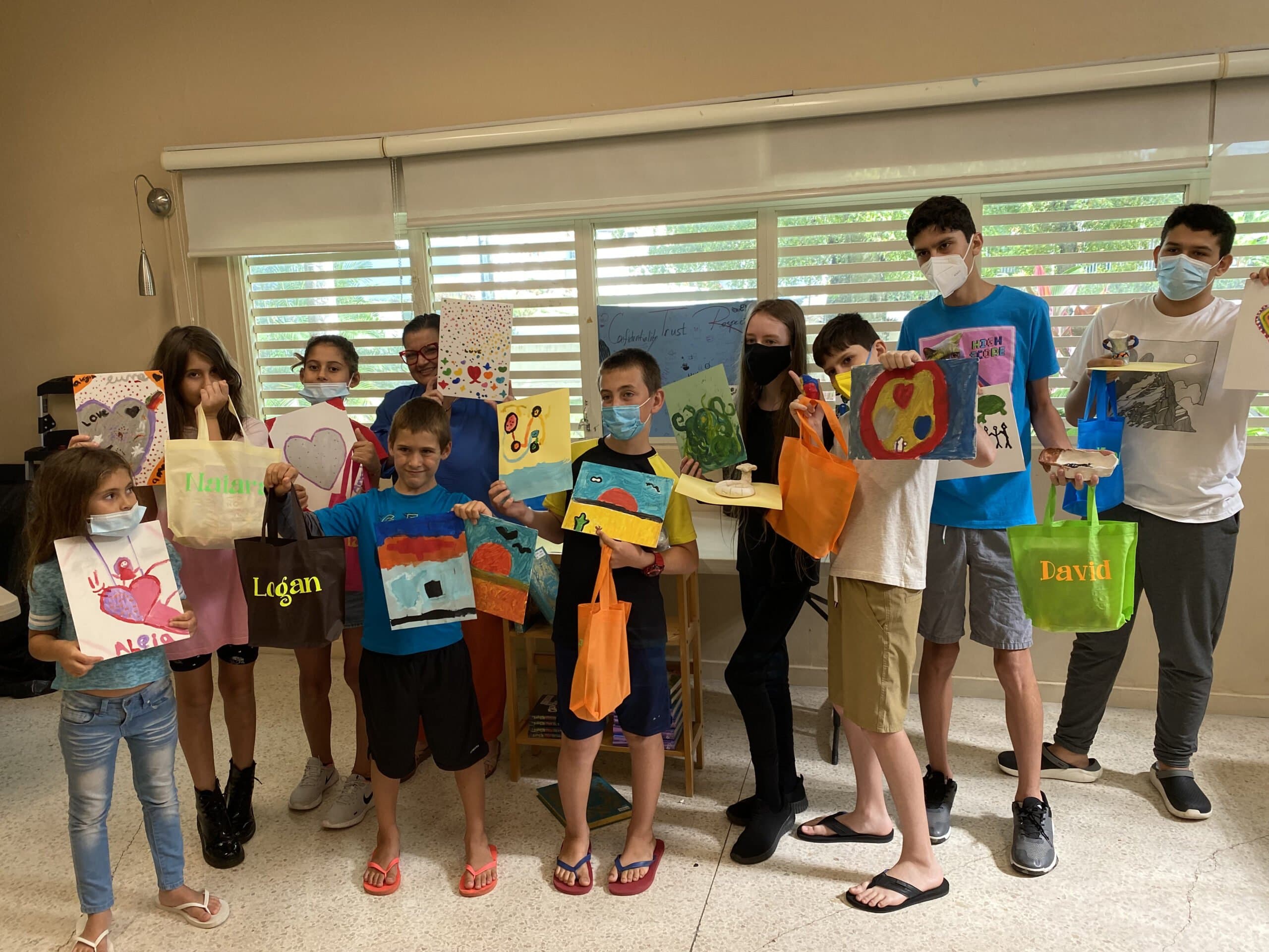 Children presenting artwork during the LLP summer program
