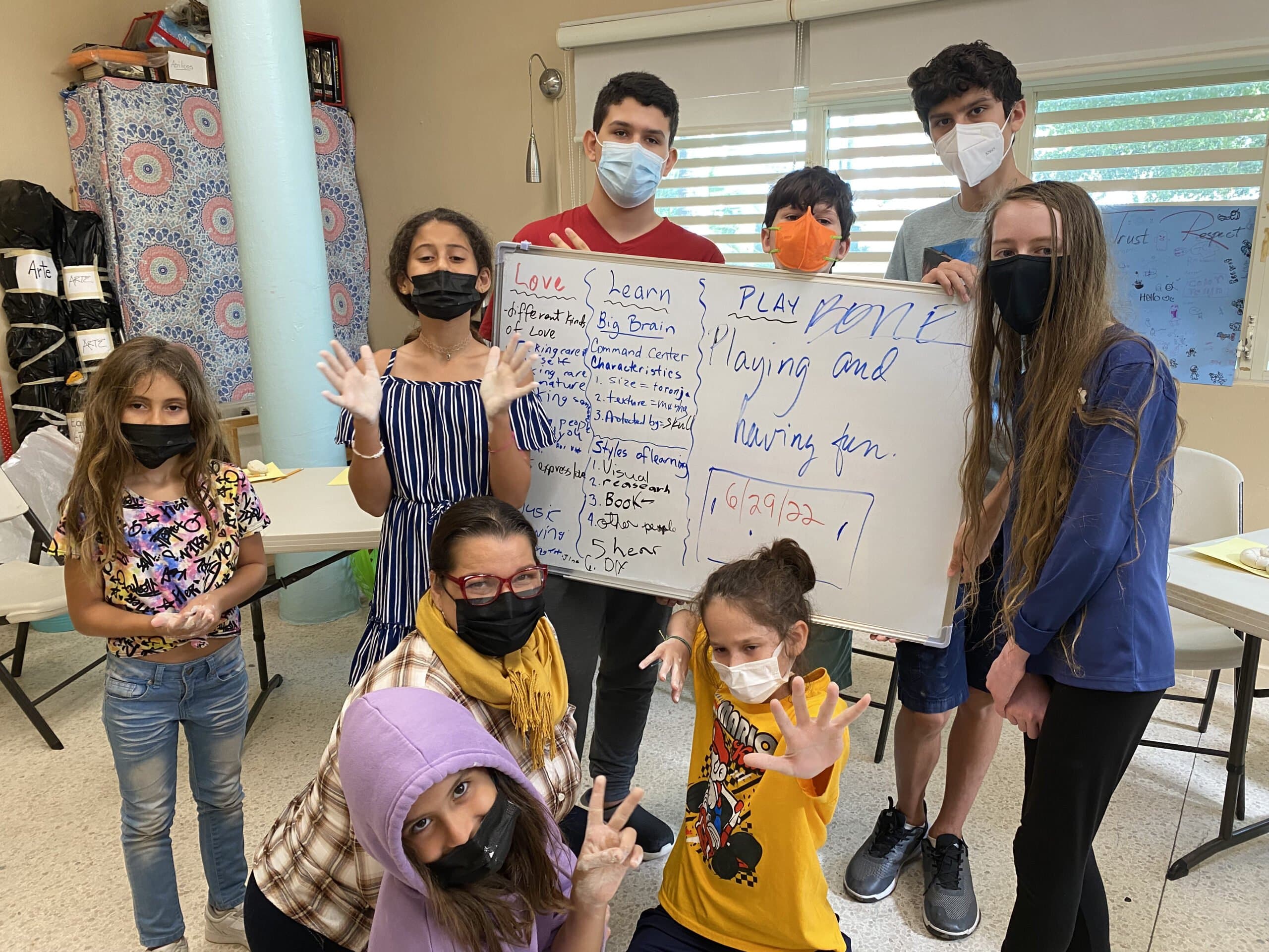 Children collaborating on group activities at the library