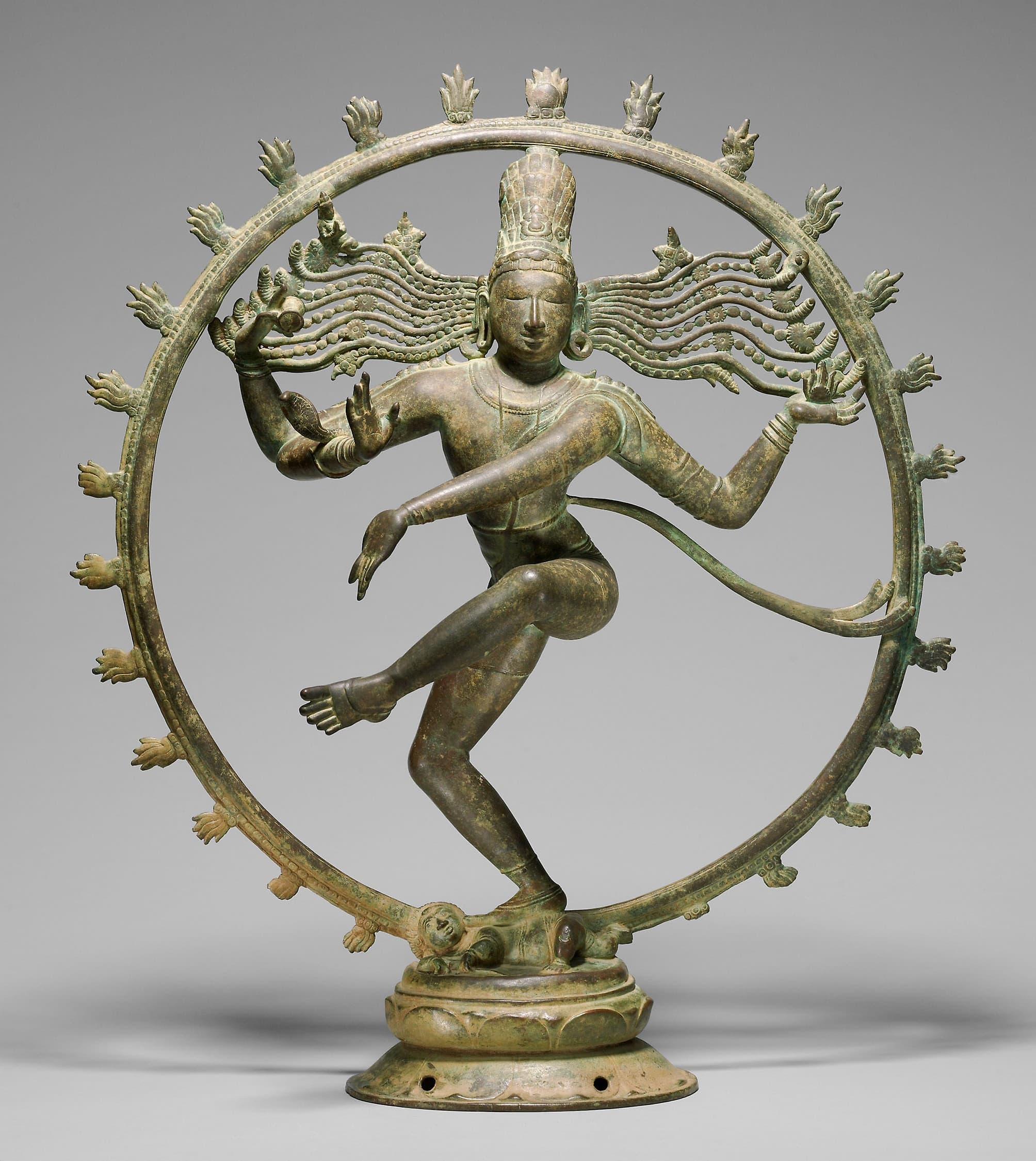 Bronze Shiva Nataraja dancing within a circular halo of flames