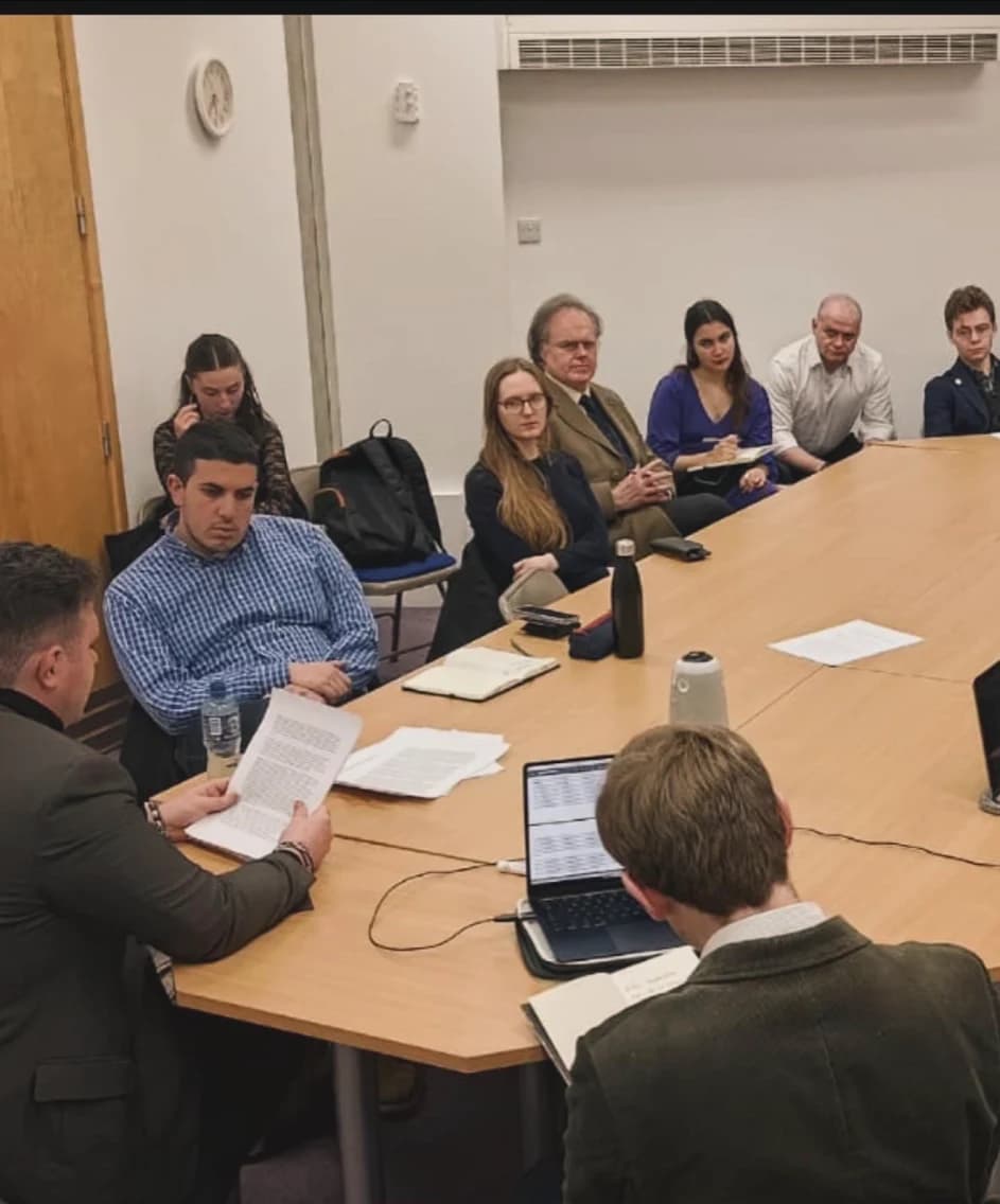 Participants listening and discussing ideas in a seminar.