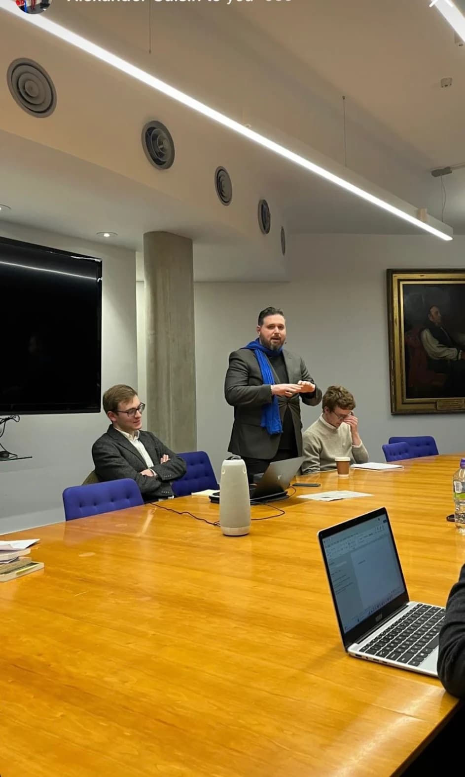 A speaker addressing the group during a seminar.