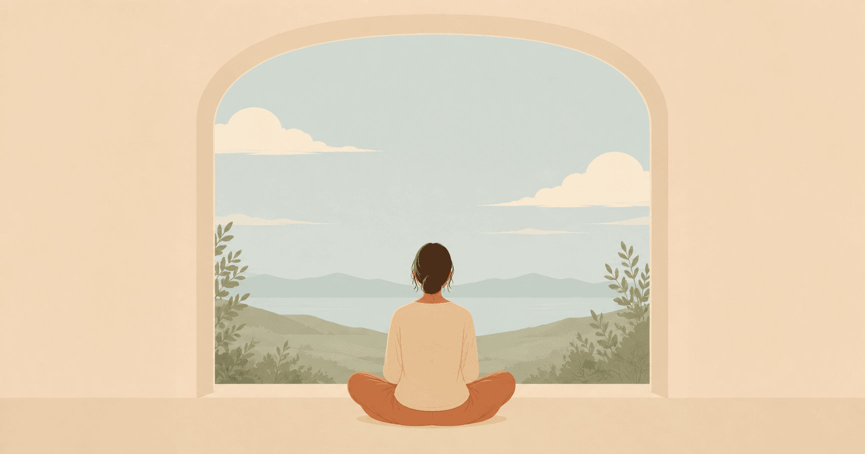 Person meditating beside a window overlooking mountains and a lake