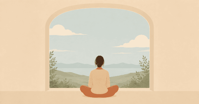 Person meditating beside a window overlooking mountains and a lake