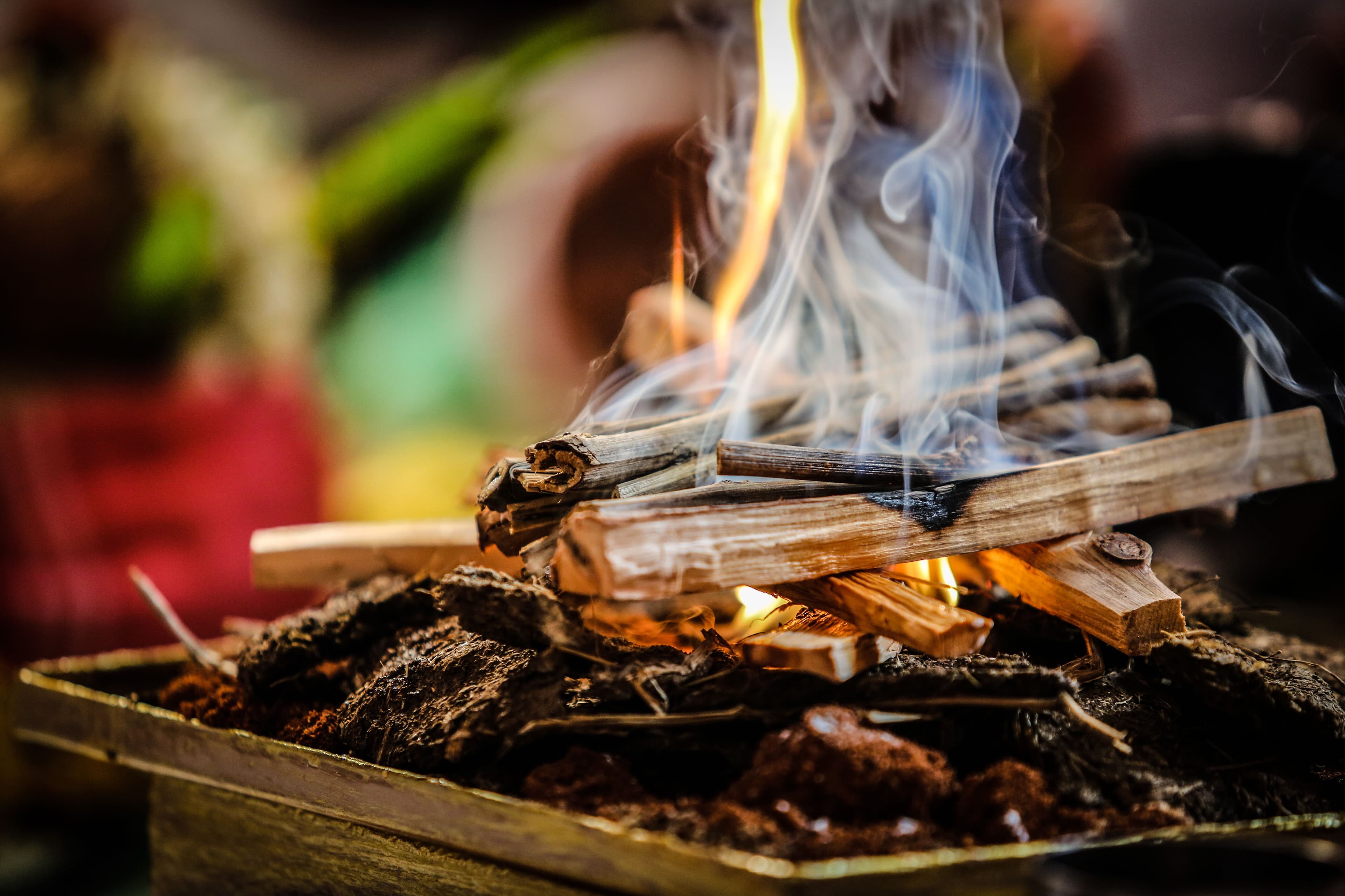Smoke rising from burning firewood.