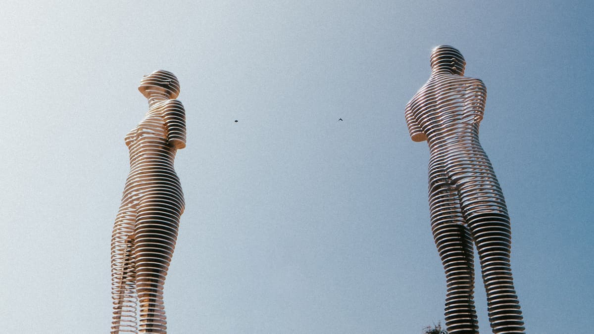 The Ali and Nino kinetic sculpture beneath a blue sky in Batumi, Georgia.