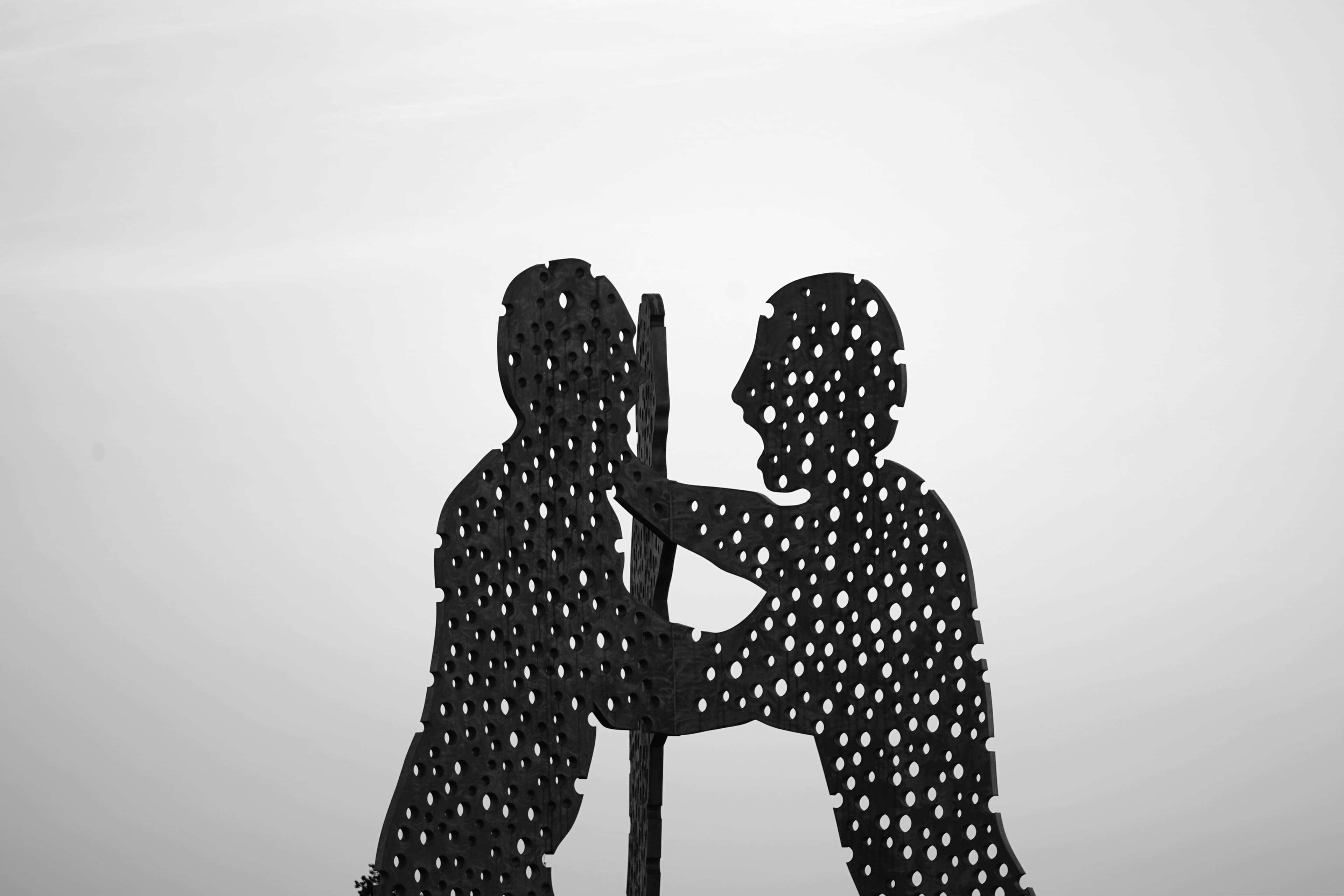 Black-and-white photograph of a silhouette sculpture in Berlin, Germany.